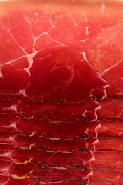 Prosciutto red meat dry pork ham texture closeup