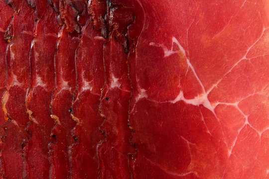 Prosciutto red meat dry pork ham texture closeup