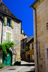 Fototapeta na wymiar Street scene and architecture of the medieval village of St. Cyprien in the Dordogne region of France