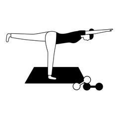 woman making yoga with mat and dumbbells