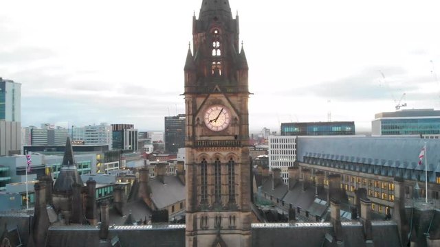 4K Drone aerial shot flying over Manchester Christmas Markets during the early cold mornings Albert Square Town Hall and above Zippy Santa Claus Statue Panning downwards