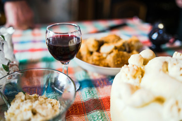 Wine, Wheat Grain and Slava Bread on the table