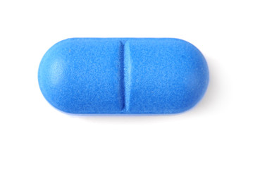 Pill on white background, top view. Medical care and treatment