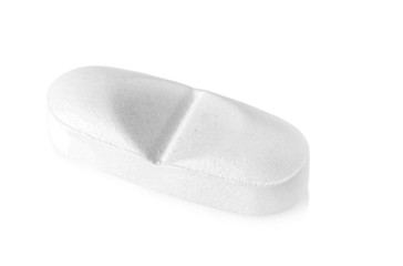 Pill on white background. Medical care and treatment