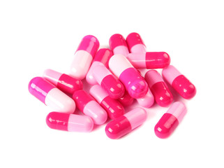Pile of color pills on white background