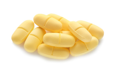 Pile of color pills on white background
