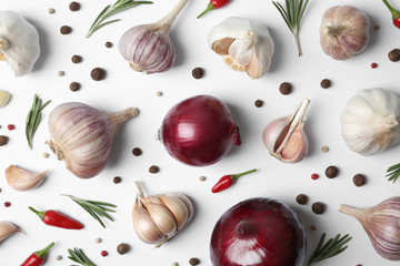 Composition with garlic, peppers and onions on white background, top view