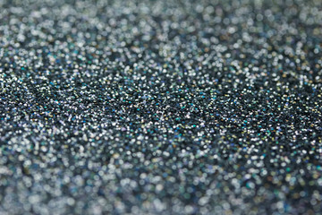 Macro abstract silver and black glitter background with bokeh