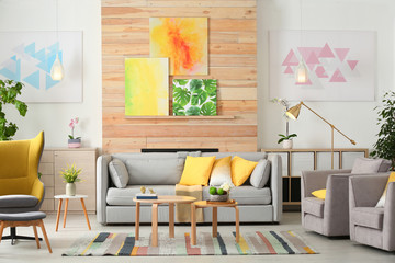Stylish living room interior with comfortable couch and decorative elements