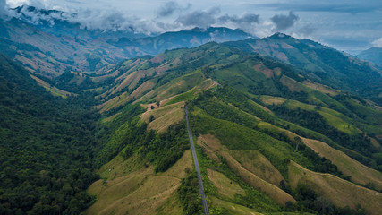 Fototapeta premium Beautiful skyline on the hill, sky road over top of Mountain, Curve road from Pua District to Boklua District