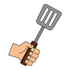 hand holding spatula