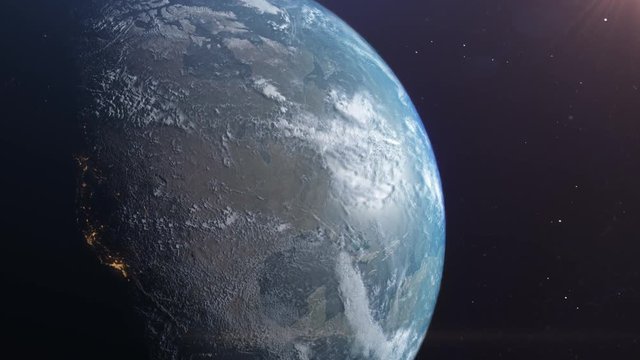 Shot of the Earth from space as the shadow of night moves across the planet you can see the lights from North America