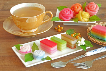 Layer sweet cake (Khanom Chan) Thai traditional dessert in colorful cube shaped and rose shaped , Thai food / Thai dessert sweet and delicious. Copy space / Space for texts