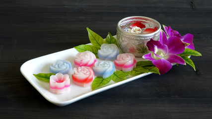 Thai dessert : Layer sweet cake (Khanom Chan) Thai traditional dessert in colorful roses and flowers shaped, one of most famous Thai cuisine. Copy space