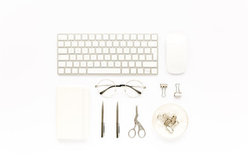 Home office workspace with computer, notepad, laptop and accessories on white background. Flat lay, top view