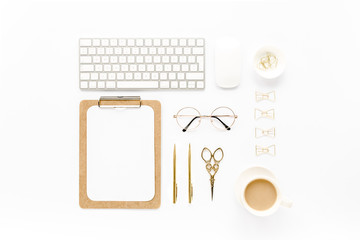 Home office workspace with computer, clipboard, laptop and golden accessories on white background. Flat lay, top view