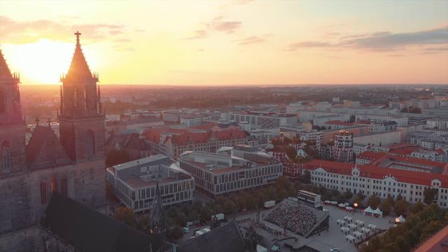 Sunset at Summertime Golden Hour behind a Cathedral with Sunbeams in Magdeburg.