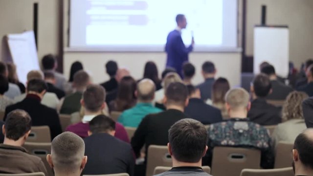 the speaker tells the speech at conference. Business People Seminar Conference Meeting Office Training Concept. Business and Entrepreneurship concept.