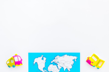 children tourism outfit with map and toys white background flat lay mockup