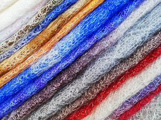 Background texture of soft wool, pattern. Colorful fluffy fur with fluff. Close-up, selective focus, side view, copy space.
