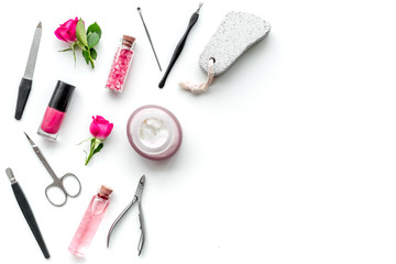tools for manicure with spa salt and rose on white background top view mock up