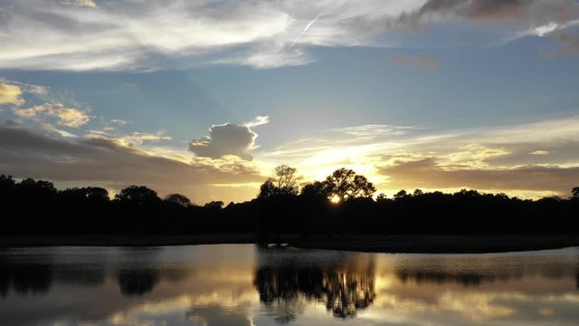 Beautiful Lake at Sunset Low Flying Drone over water Serene