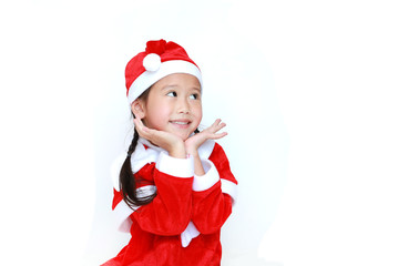Happy child girl in Santa costume dress with copy space on white background. Merry Christmas and Happy New Year Concept.