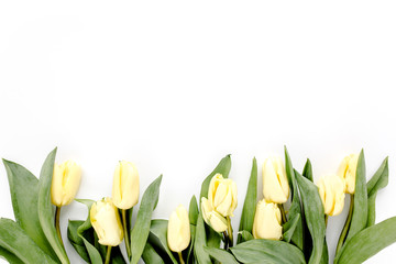 Pastel and yellow tulip flowers bouquet on white background. Flat lay, top view. Valentine's background. Floral pattern.