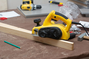powerful Electric Wood Planer closeup. Woodworker workplace template with copyspace