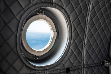 Window and interior of military plane.