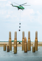 Soldiers on a rescue military operation with helicopter.