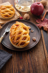 Homemade Apple pie or tart on autumn background. Autumn concept. Copy space.
