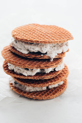 Stack of ice cream sandwiches with cookies isolated on a white background. Copy space.