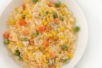 Fried rice in white plate on wood

