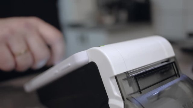 Smart terminal in operation. Online ticket office with a terminal. electronic cash register close-up. checkout.