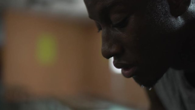 Close up on a face of an African  basketball player taking a break after a basketball game