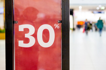 Shopping sale. seasonal half price discount on clothes.shopping mall,center,Sale label sign in front of shop,Sale shopping season for discount display,marketing business advertisement for clearance