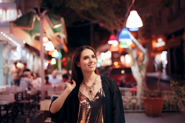 Happy Tourist Shopping in the Evening in the City