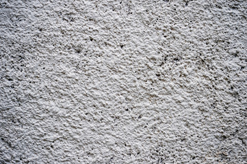 White textured wall with a three-dimensional pattern decorated with clay surface. Background