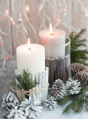 Christmas candles, cones on the table
