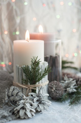 Christmas candles, cones on the table