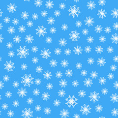 Seamless pattern. White snowflakes on a blue backgrounds. For packaging paper
