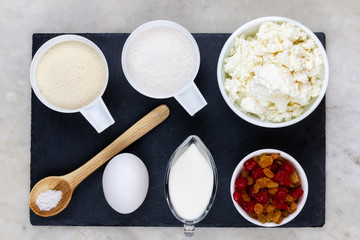Ingredients for cheese curd casserole with dried berries