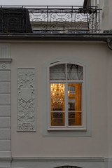 Fototapeta na wymiar cafe window facade with lustre at evening