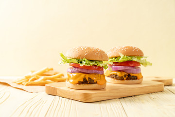fresh tasty beef burger with cheese and french fries