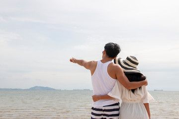 Couple is dating at the beach 