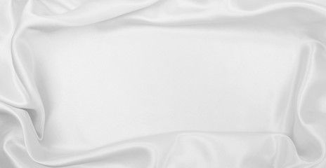 Smooth elegant white silk or satin luxury cloth texture as wedding background. Luxurious Christmas...