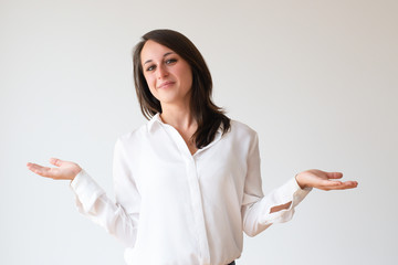 Positive customer comparing products or offers. Beautiful young woman pointing hands at copy spaces...