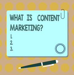 Conceptual hand writing showing What Is Content Marketing. Business photo showcasing Advertising and business promotion strategies Square Color Board with Magnet Click Ballpoint Pen and Clip