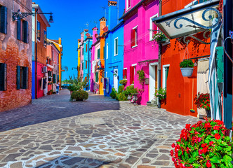 Street with colorful buildings in Burano island, Venice, Italy. Architecture and landmarks of Venice, Venice postcard - obrazy, fototapety, plakaty